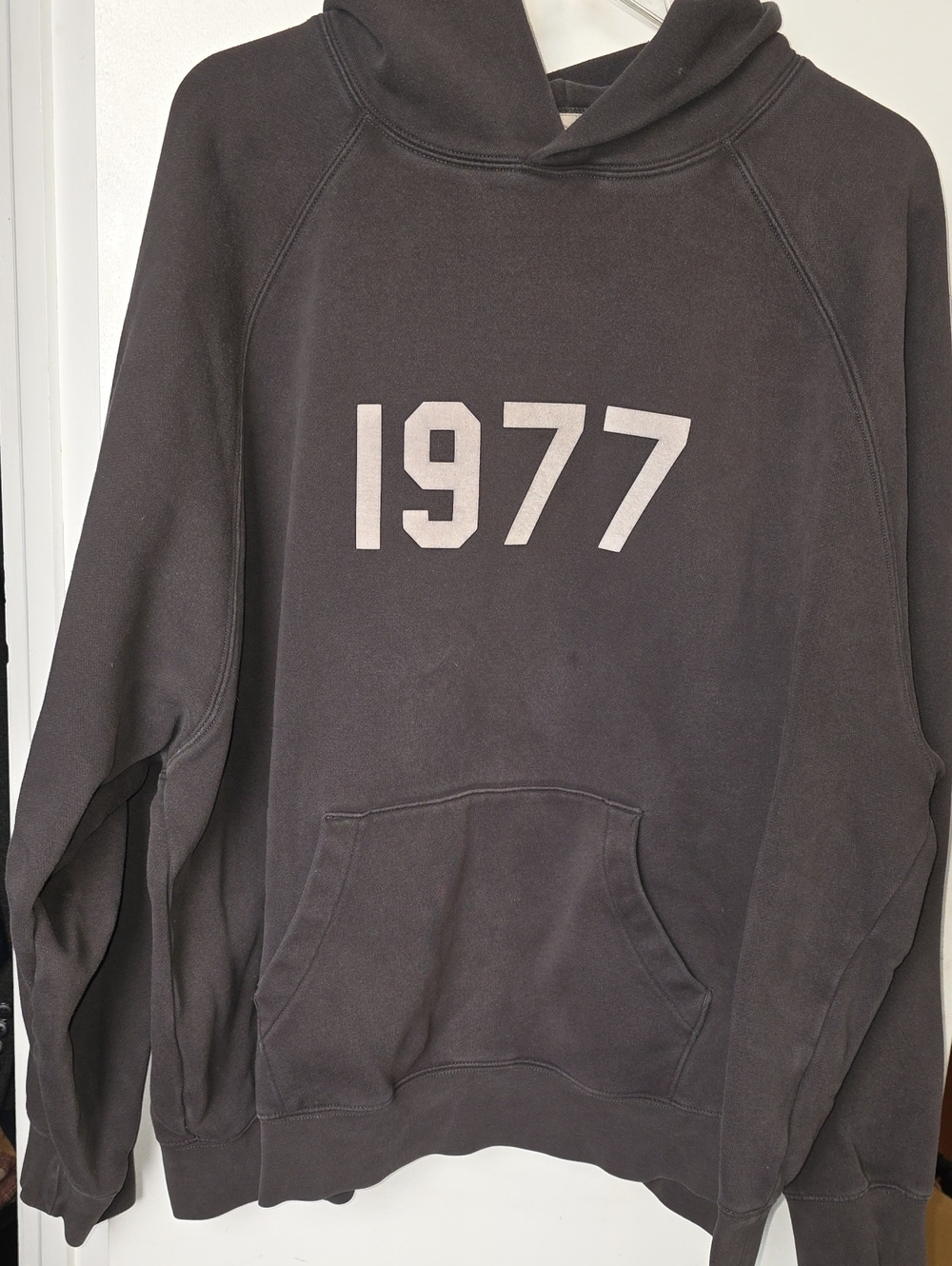 Essentials Black Pullover Hoodie with 1977 Chest Graphic
